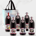 na obrazku je pac 6 fliaš v skle plných 100% šťavy z ovocia a luxusná darčeková taška s valentinsky m pozadim